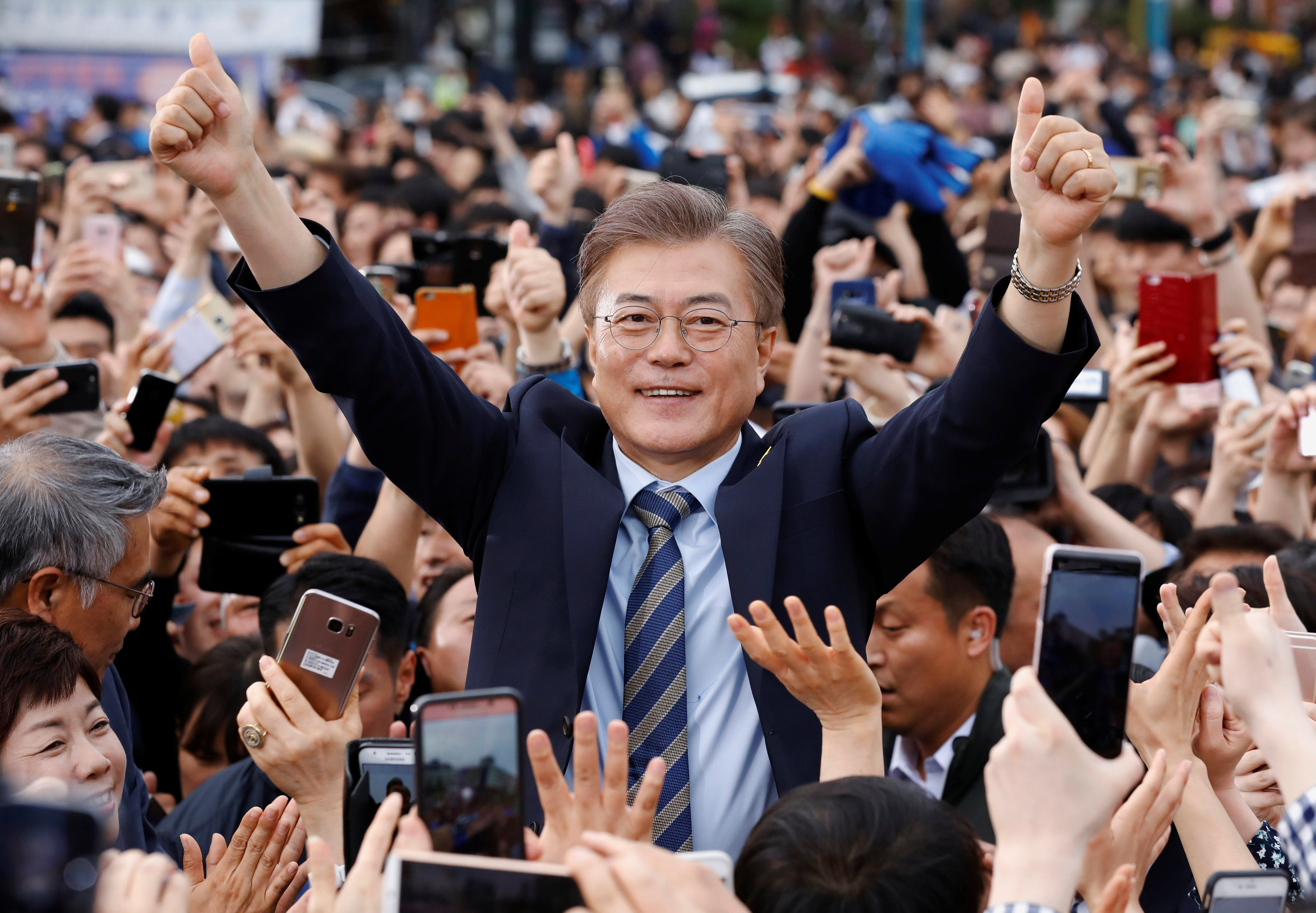 Moon Jae-in, the presidential candidate of the Democratic Party of Korea, is greeted by his supporters during his election campaign rally in Goyang